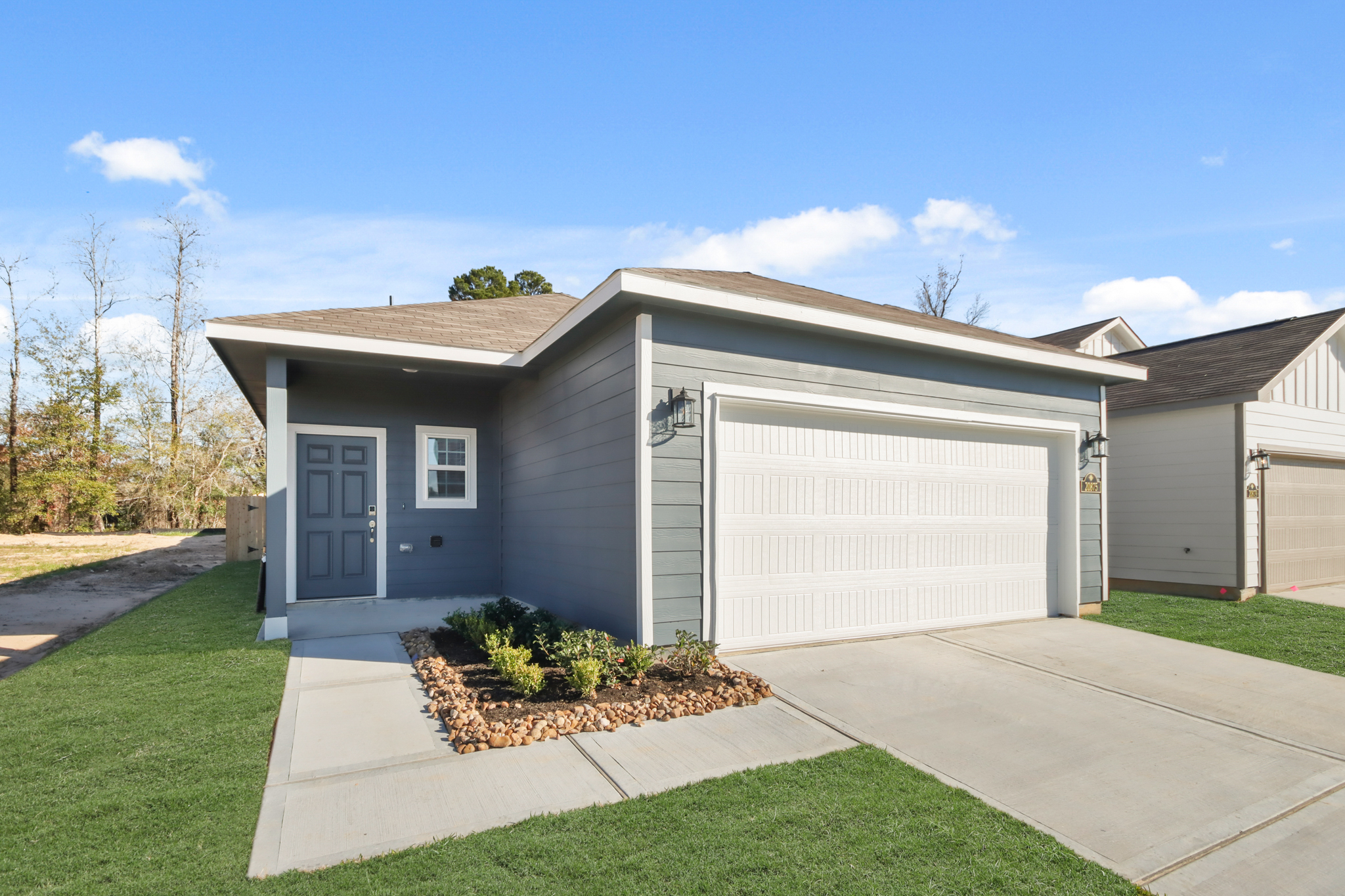 A house with garages and a driveway.