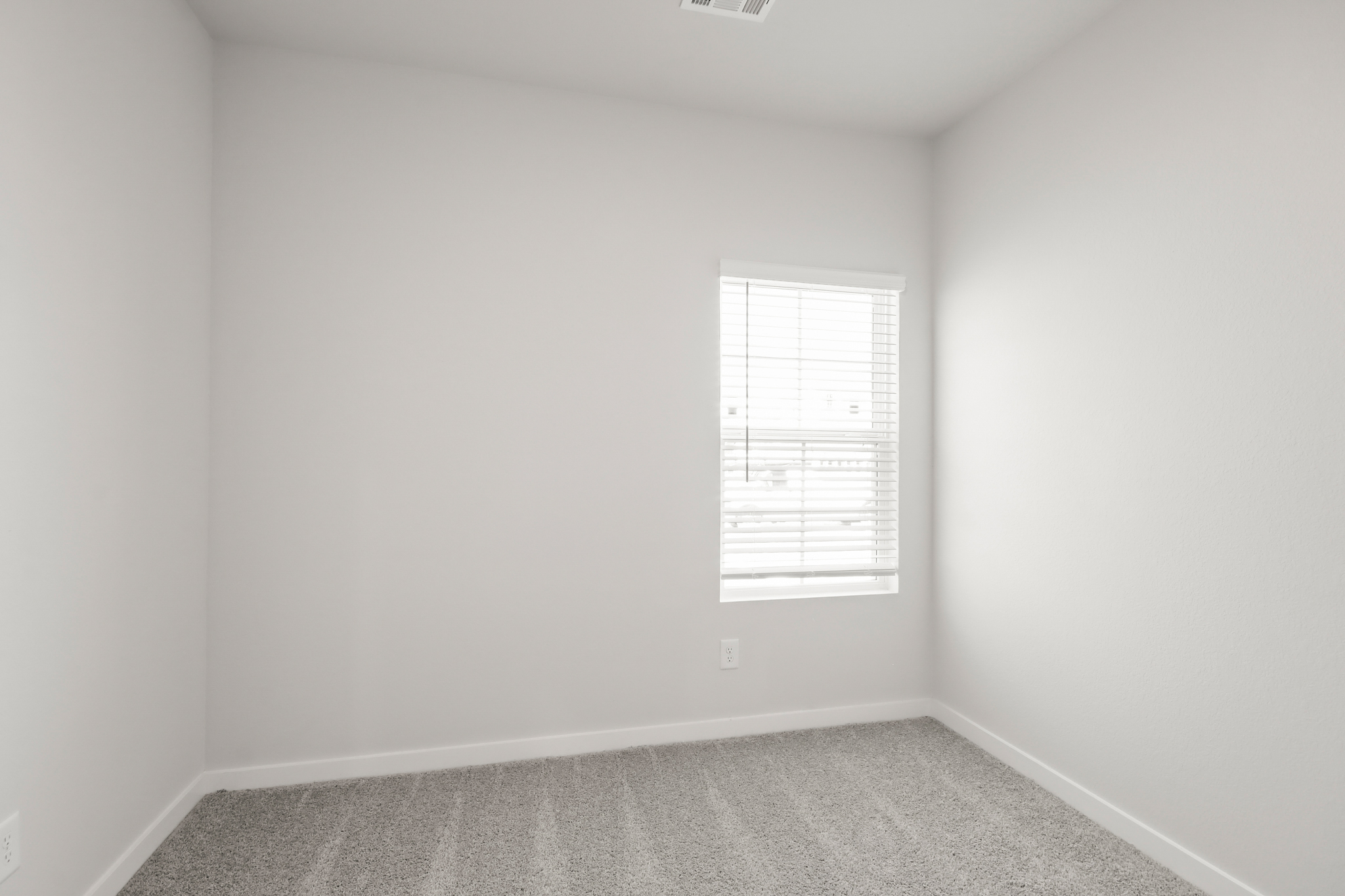 A hallway with a door.