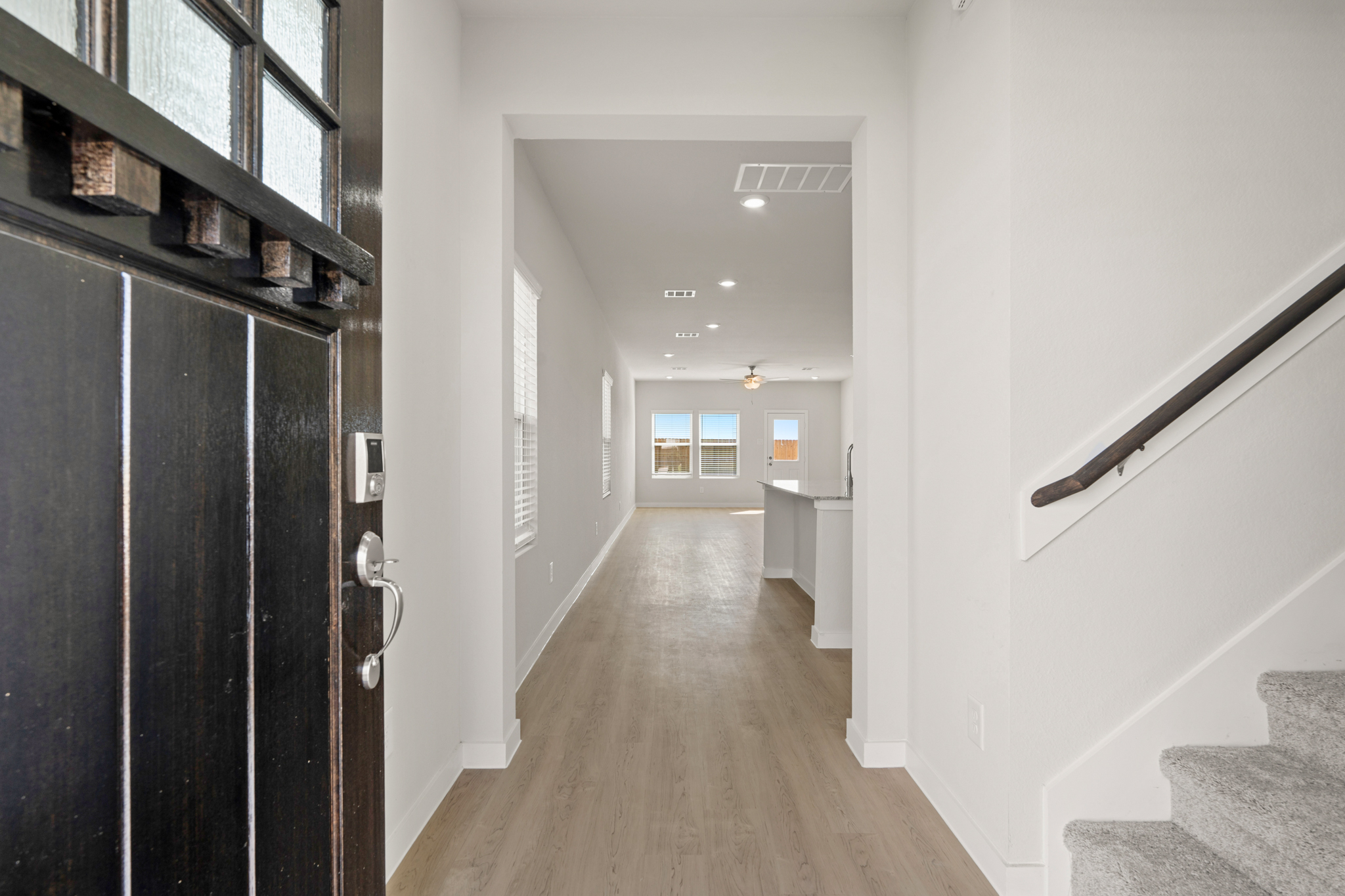 A hallway with white walls.