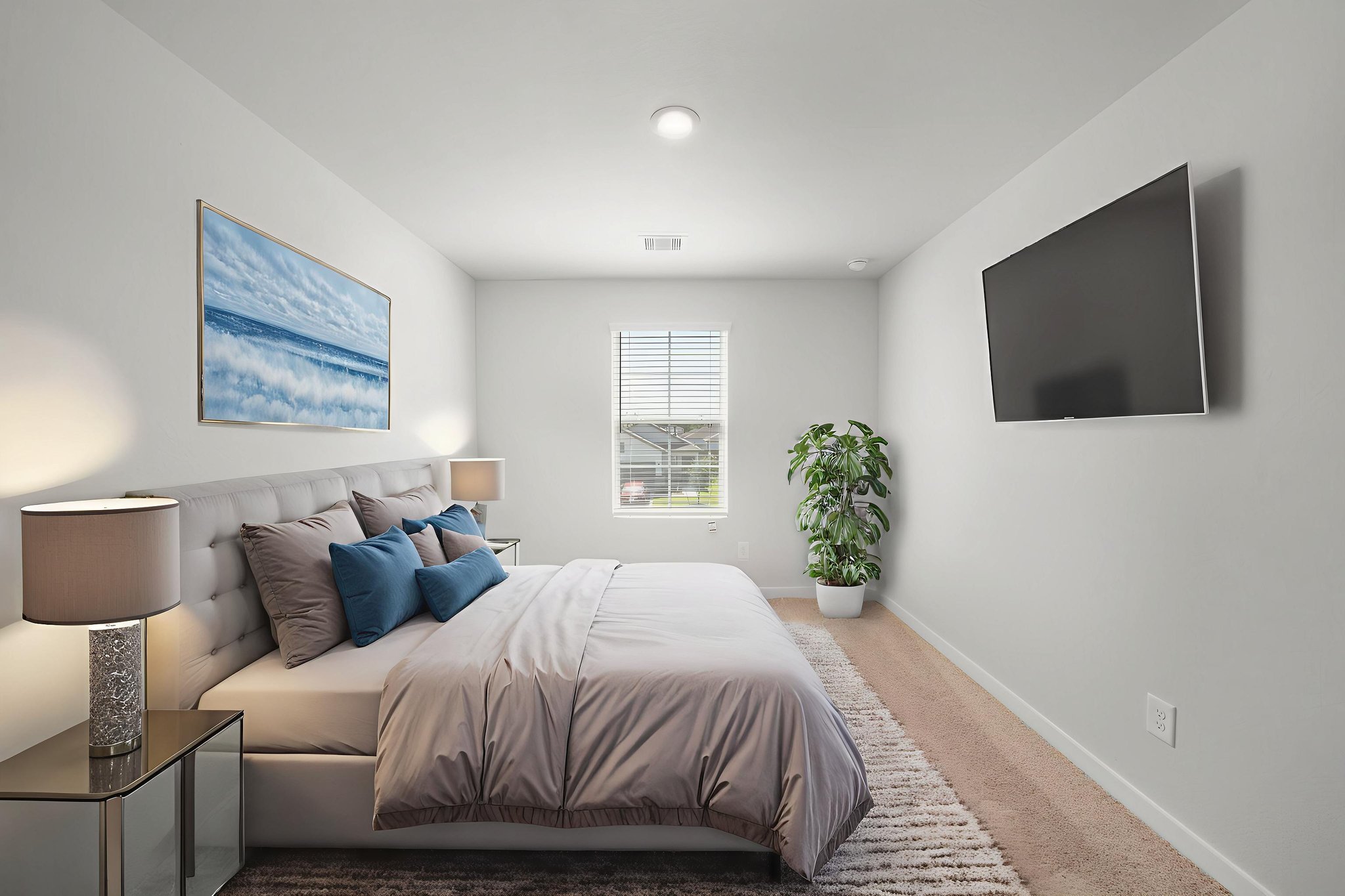 A bedroom with a large bed.