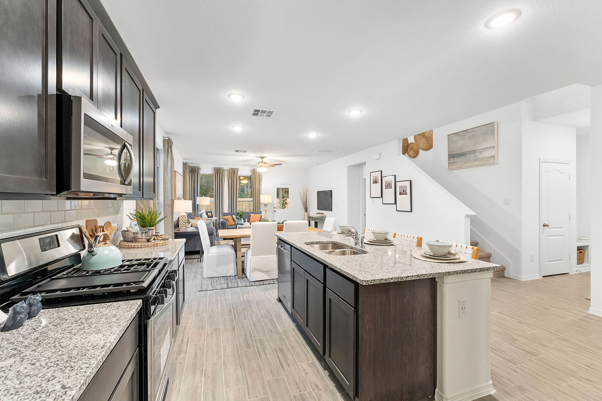 A kitchen with a wood floor.