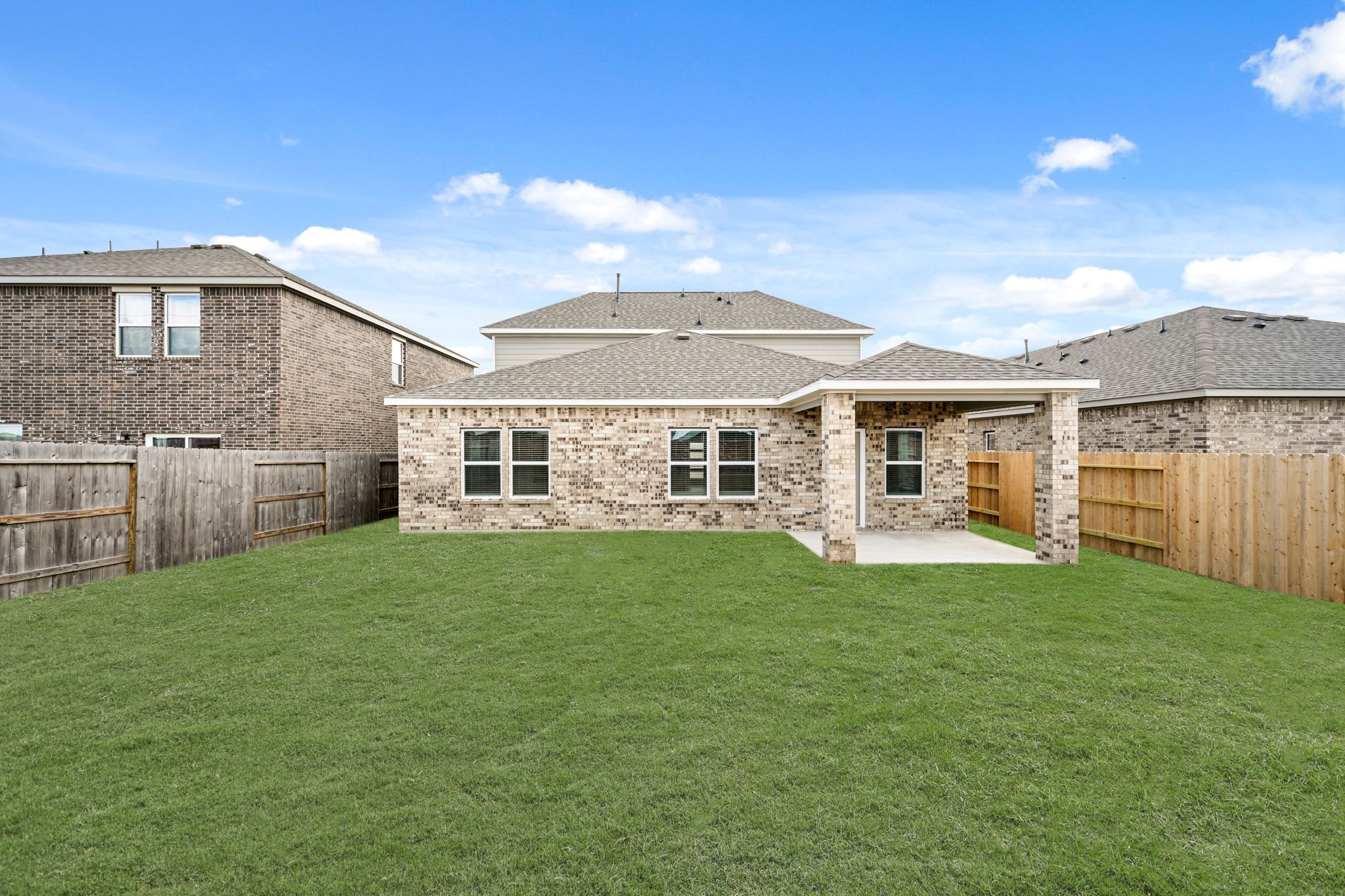 A large house with a fence around it.