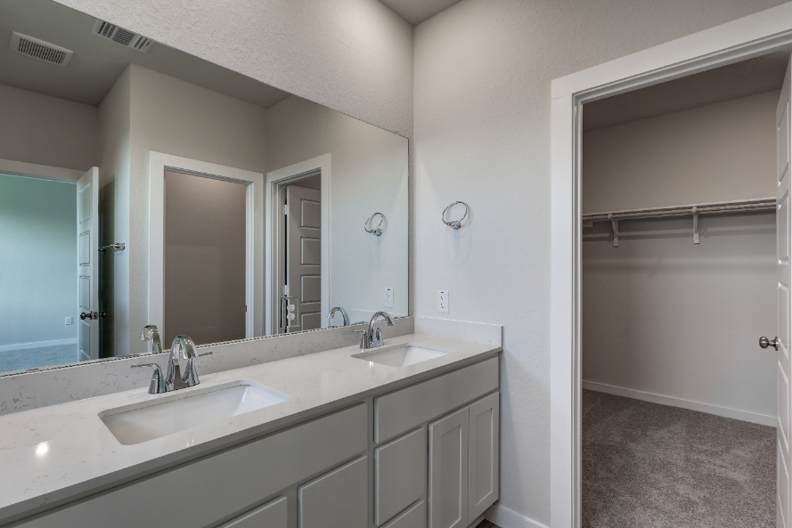 A bathroom with a couple of sinks.