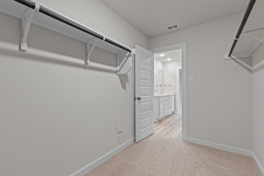 A hallway with white walls.