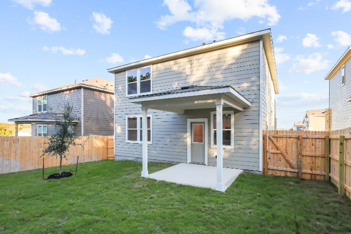 A small house with a fence.