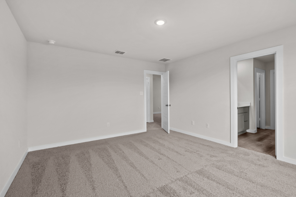 A long hallway with white walls.