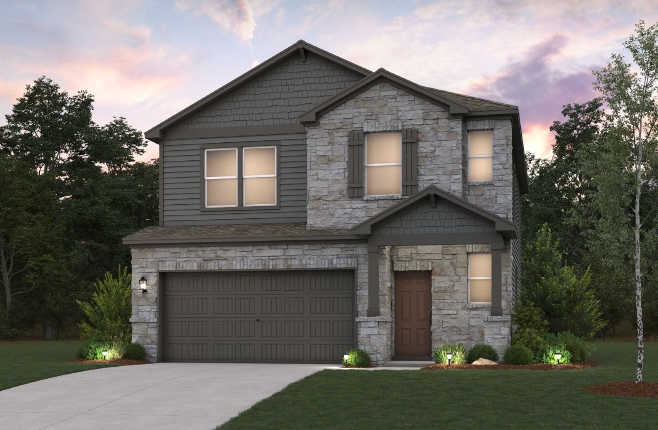 A grey house with a driveway.