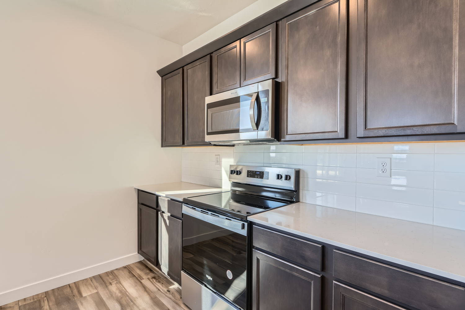 A kitchen with black appliances.