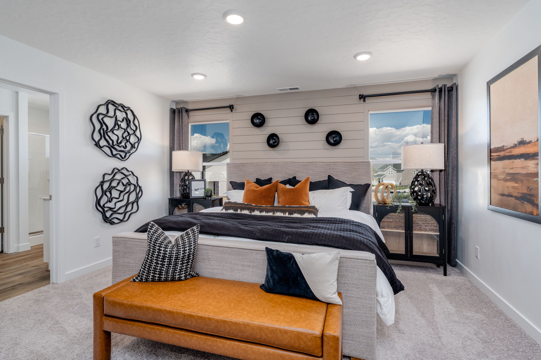 A bedroom with a bed and a couch.