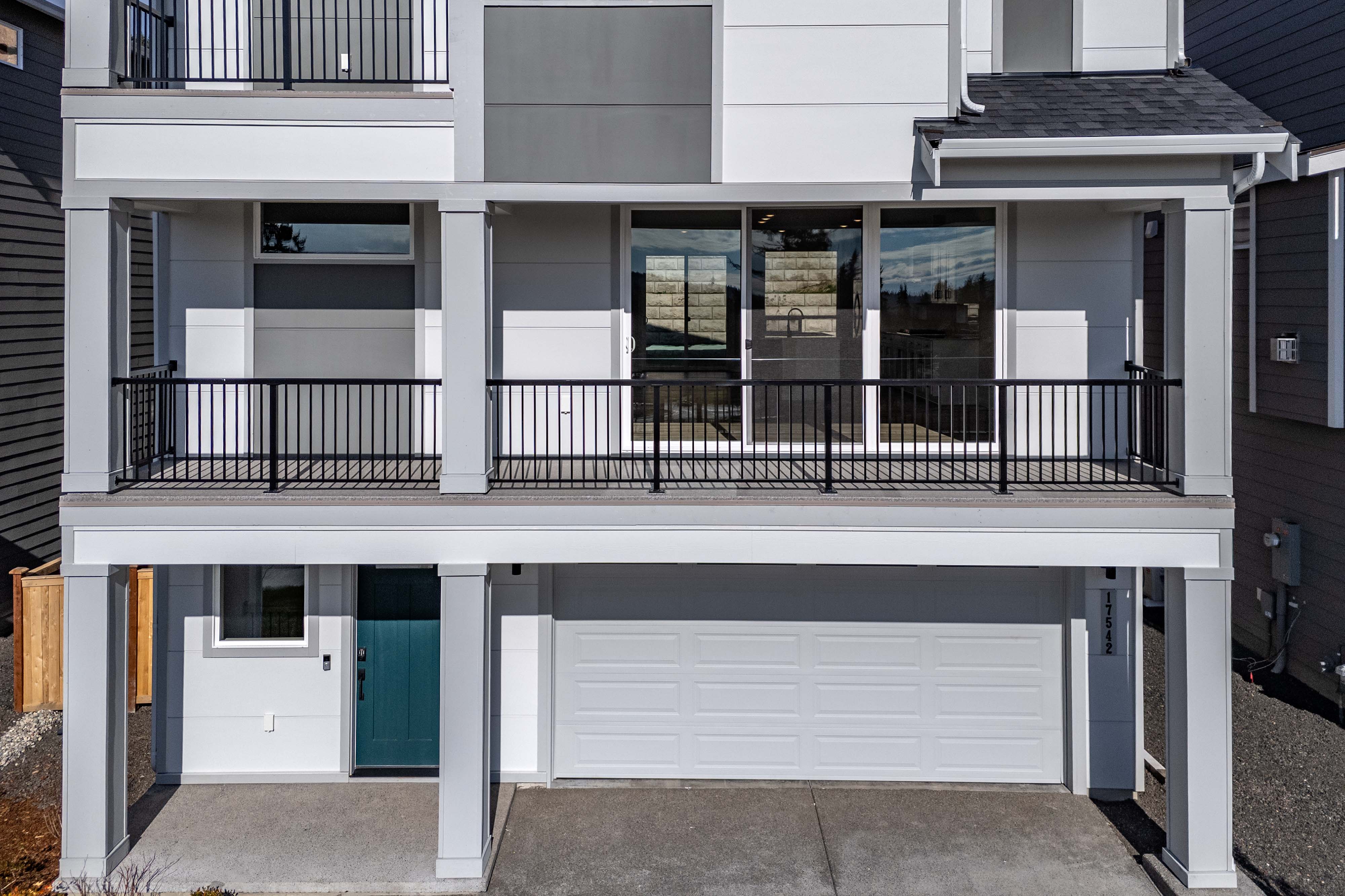 A building with a black railing.