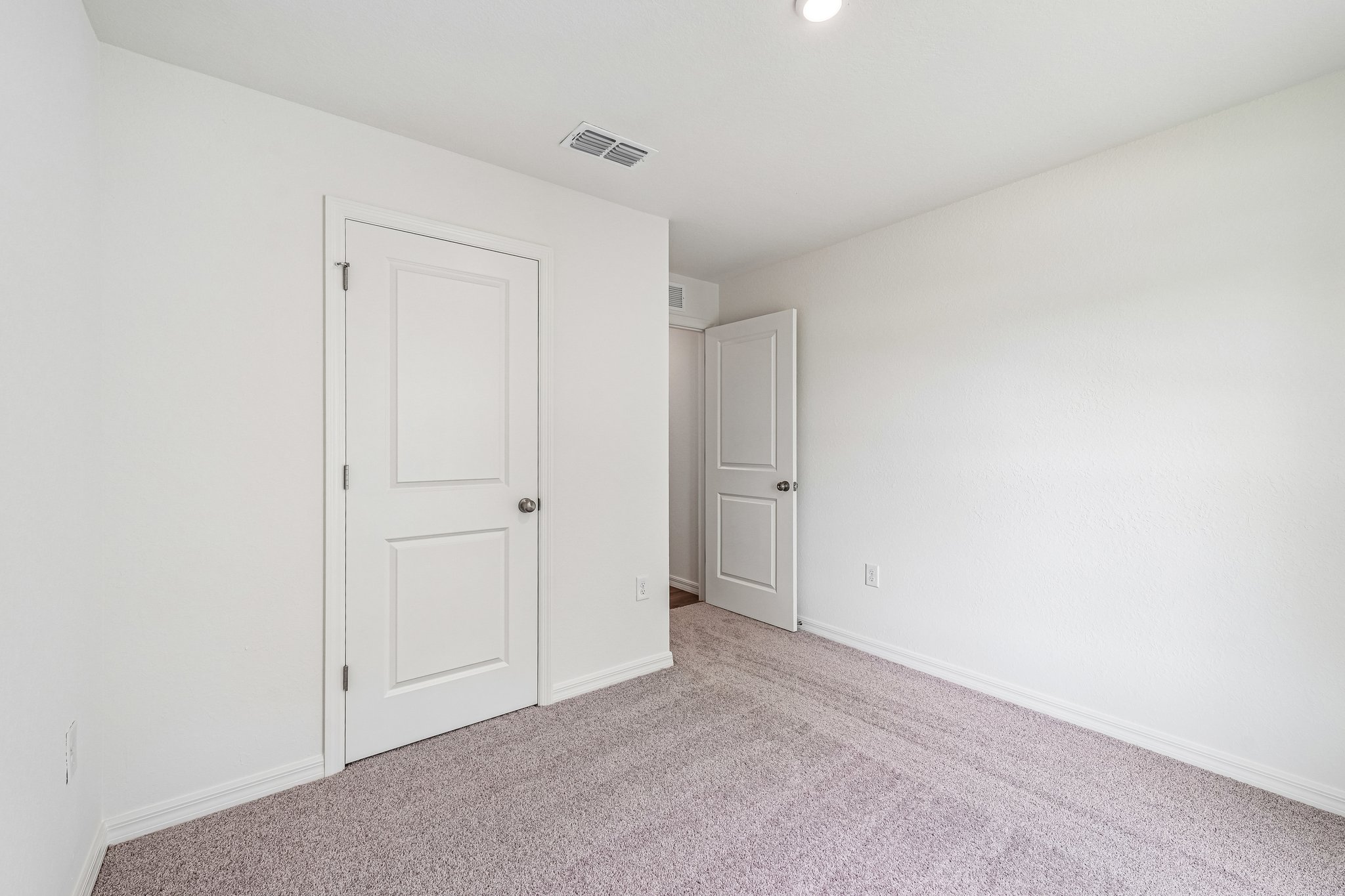 A room with white doors.