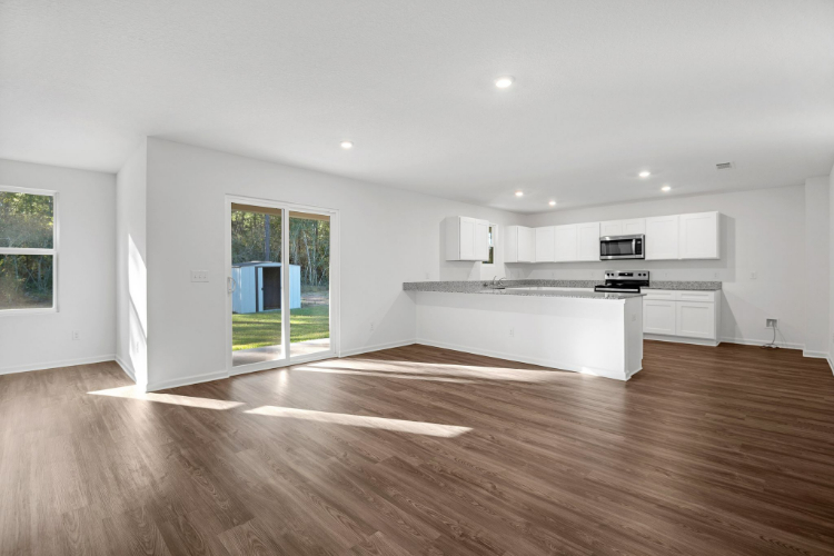 A large kitchen with white cabinets.