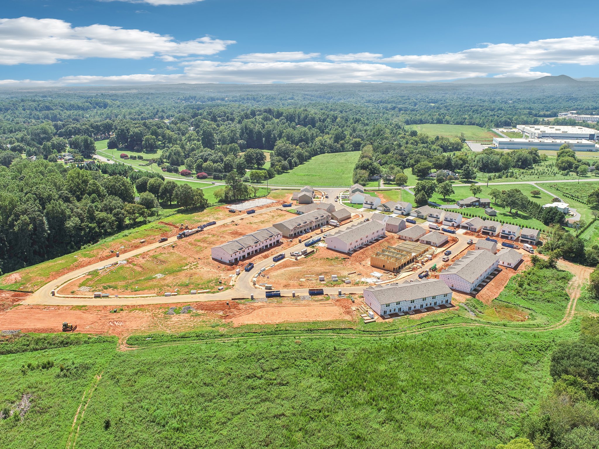 A large area with many buildings and trees around it.