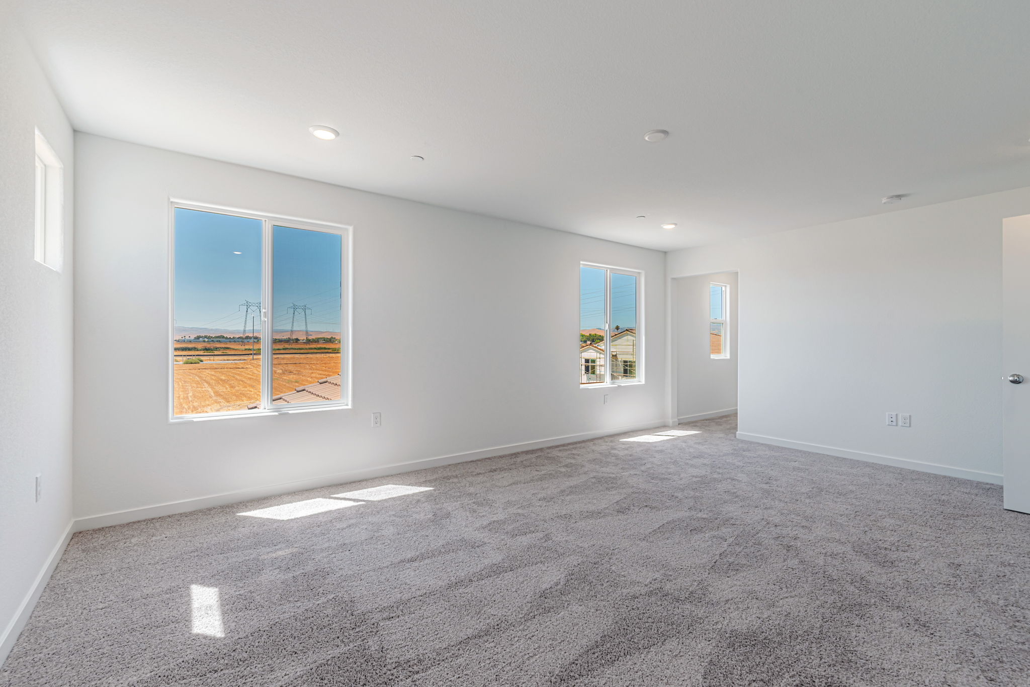 A room with white walls and windows.